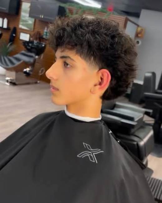 Curly taper haircut at X-Ecutive Barbershop in North Easton, MA